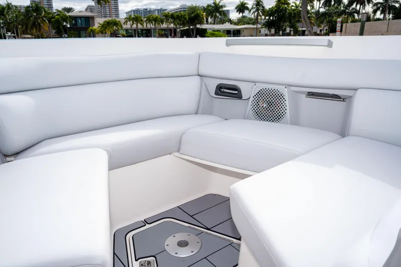 Slide: The Image of 2022 Aviara AV32 OB boat interior with white seating and speaker system. - 13
