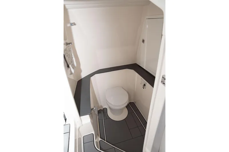 Slide: The Image of 2022 Aviara AV32 OB boat bathroom interior with modern design and compact layout. - 14