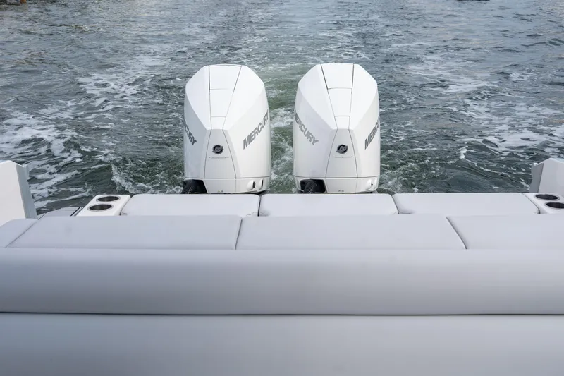 Slide: The Image of 2022 Aviara AV32 OB boat with dual Mercury outboard engines on water. - 17