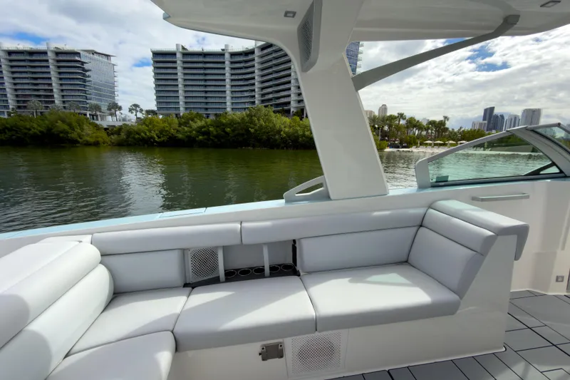 Slide: The Image of Luxurious seating on 2022 Aviara AV32 OB boat with scenic waterfront view. - 19