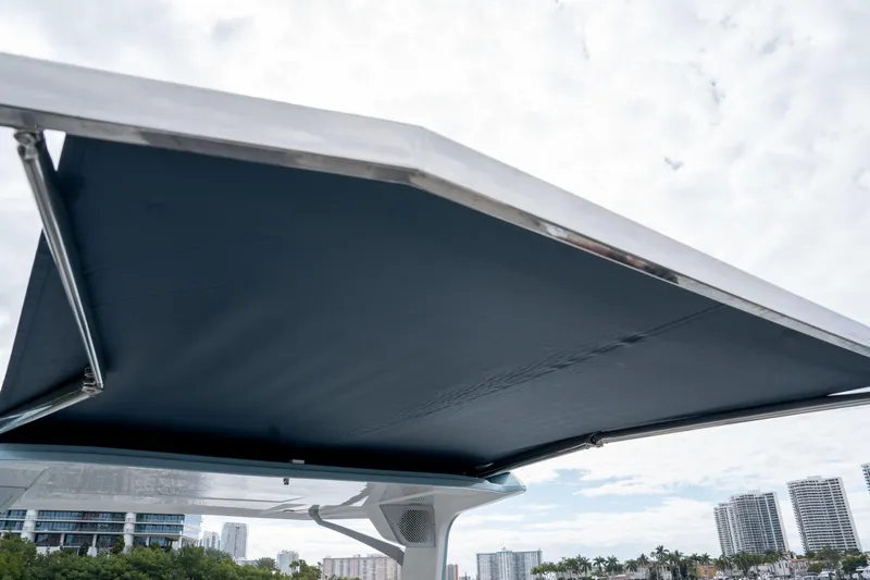 Slide: The Image of 2022 Aviara AV32 OB boat canopy with city skyline in background. - 23