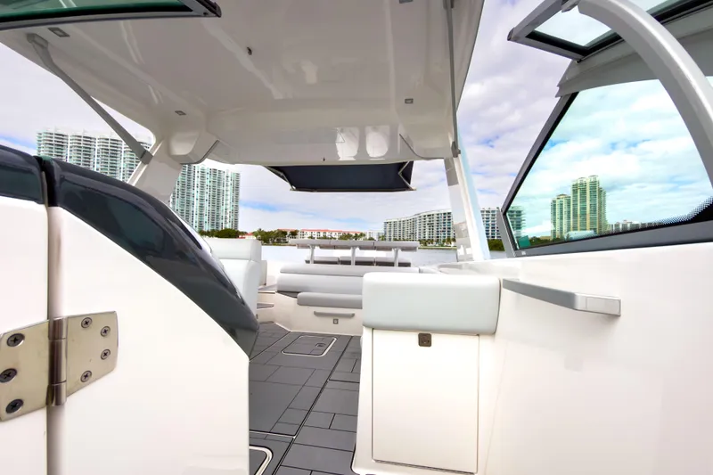 Slide: The Image of 2022 Aviara AV32 OB boat interior with modern design and cityscape view. - 37