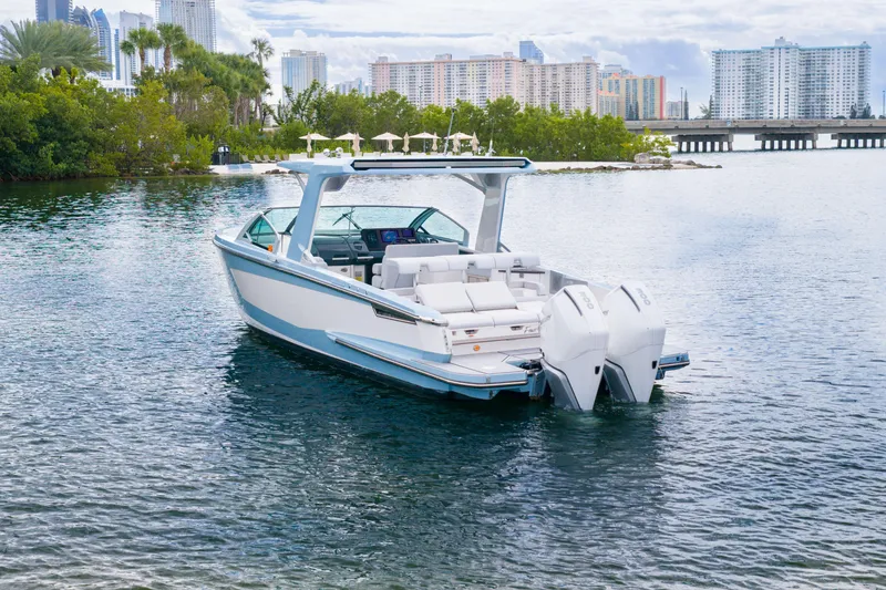 Slide: The Image of 2022 Aviara AV32 OB boat on water with city skyline background. - 5
