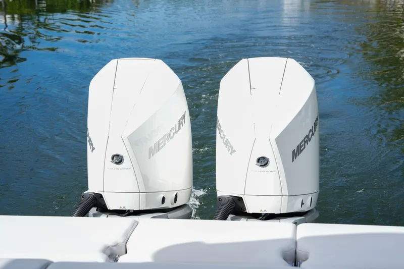 Slide: The Image of Twin Mercury outboard engines on a 2022 Aviara AV32 OB boat in water. - 9