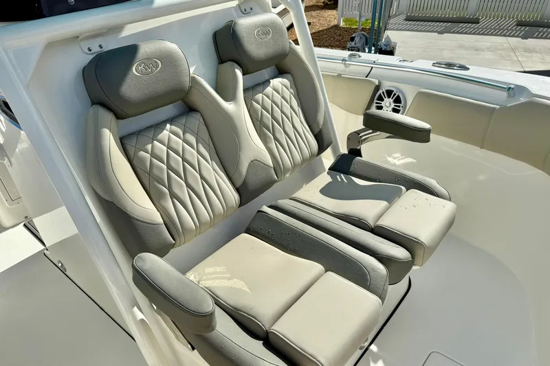 Slide: The Image of 2025 Key West 291 FS boat interior with open storage compartments and seating. - 21