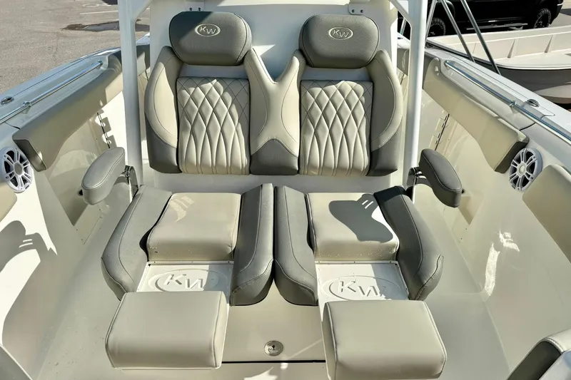 Slide: The Image of 2025 Key West 291 FS boat interior with cushioned seating and built-in speakers. - 22