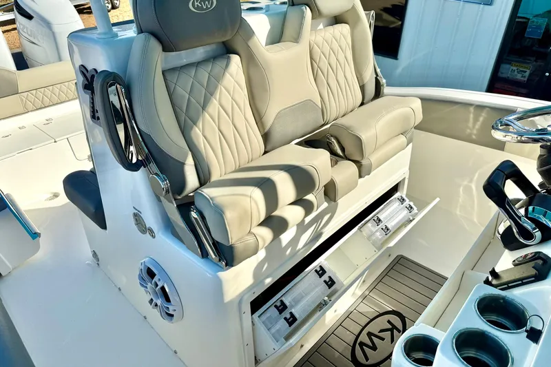 Slide: The Image of 2025 Key West 291 FS boat cockpit with modern controls and palm tree logo. - 31
