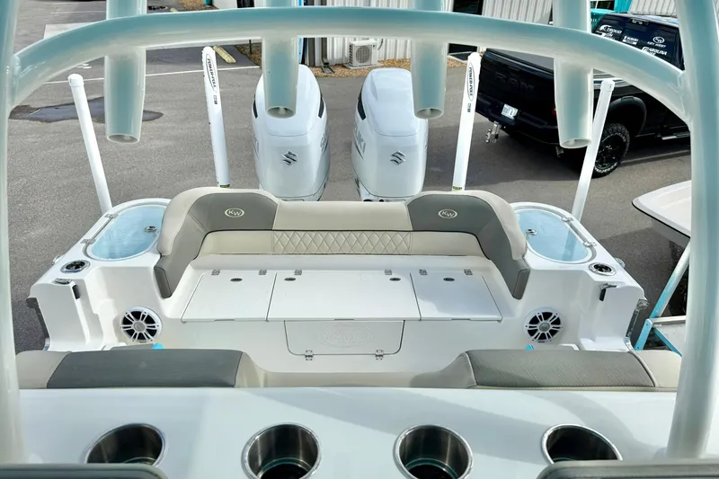 Slide: The Image of 2025 Key West 291 FS boat interior with cushioned seating and storage compartments. - 54