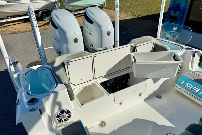 Slide: The Image of 2025 Key West 291 FS boat with organized tackle storage and seating area. - 55
