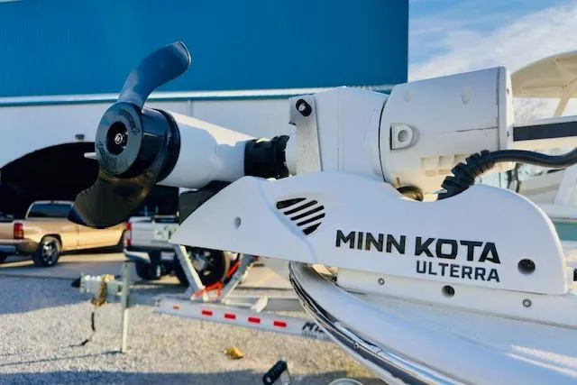 Slide: The Image of Minn Kota Ulterra motor on 2025 Boston Whaler 190 Montauk boat, parked outdoors. - 7