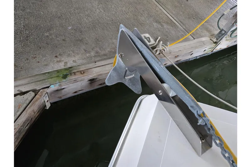 Slide: The Image of Anchor of 2001 Commander Flybridge Sedan boat docked at marina. - 10