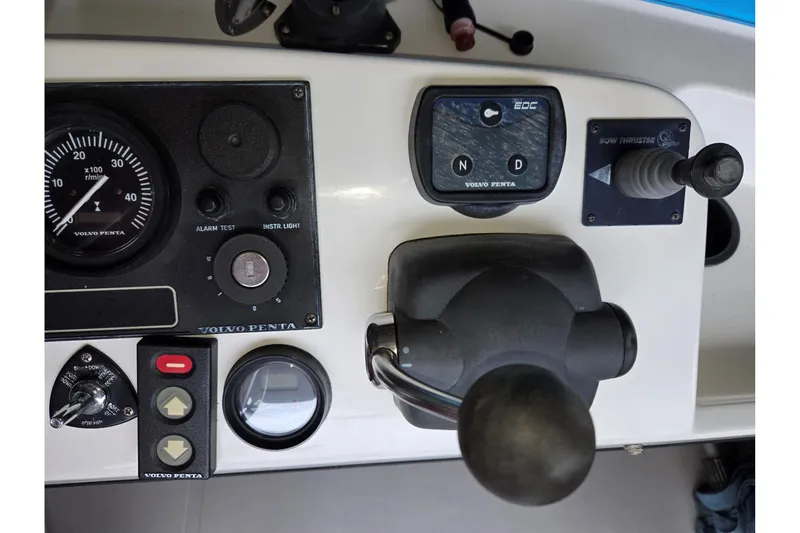 Slide: The Image of Control panel of a 2001 Commander Flybridge Sedan boat with Volvo Penta components. - 19