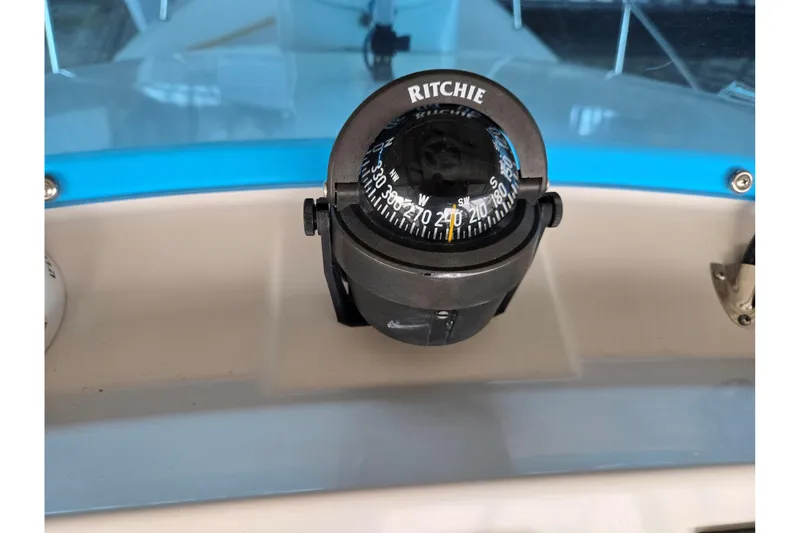 Slide: The Image of Compass on 2001 Commander Flybridge Sedan boat dashboard. - 21