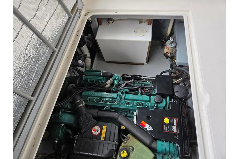 Slide: The Image of Engine compartment of 2001 Commander Flybridge Sedan with visible Volvo Penta engine components. - 42