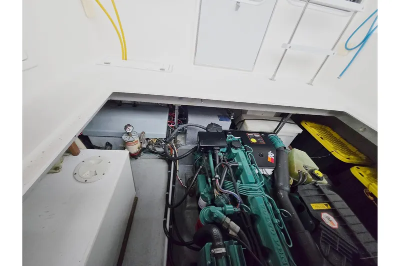 Slide: The Image of Engine room of 2001 Commander Flybridge Sedan with visible machinery and equipment. - 44