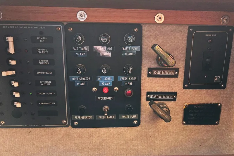 Slide: The Image of Electrical control panel of a 2001 Commander Flybridge Sedan boat. - 47