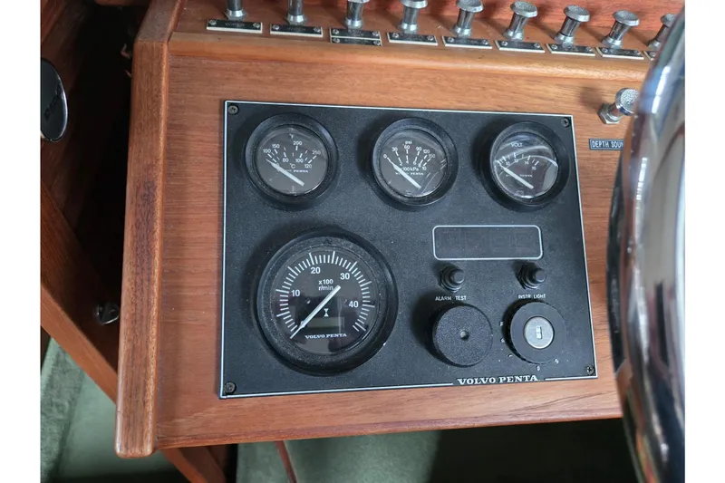 Slide: The Image of Control panel of a 2001 Commander Flybridge Sedan boat with Volvo Penta gauges. - 57