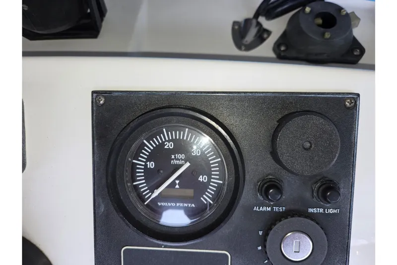 Slide: The Image of Instrument panel of a 2001 Commander Flybridge Sedan with Volvo Penta tachometer. - 58