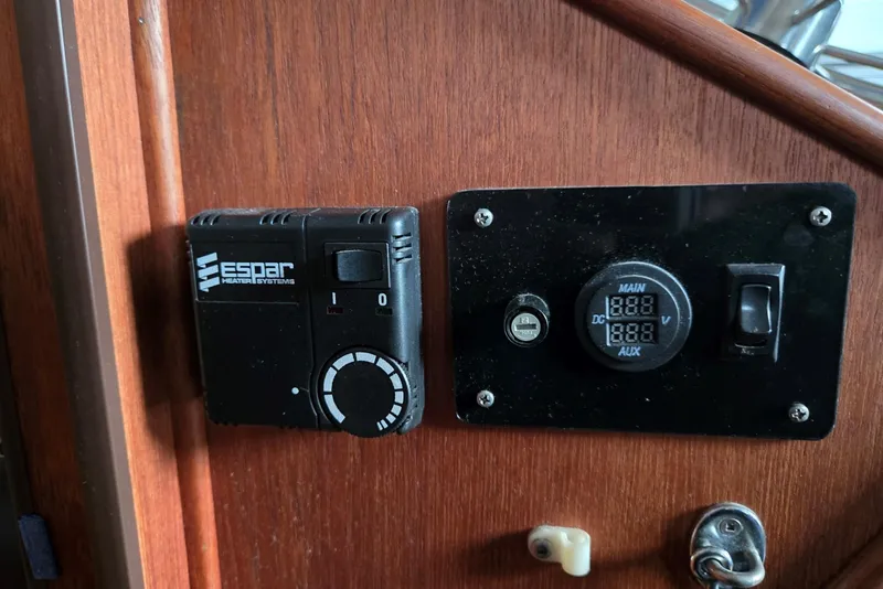 Slide: The Image of Control panel on 2001 Commander Flybridge Sedan with Espar heater system and voltage display. - 65