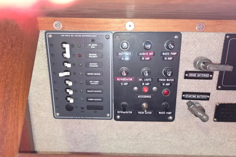 Slide: The Image of Electrical control panel on a 2001 Commander Flybridge Sedan boat. - 66