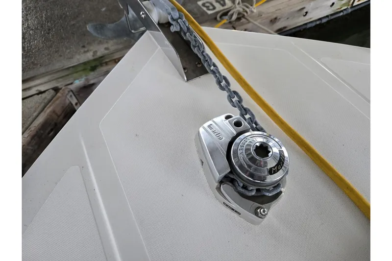 Slide: The Image of Anchor chain and winch on 2001 Commander Flybridge Sedan boat deck. - 9