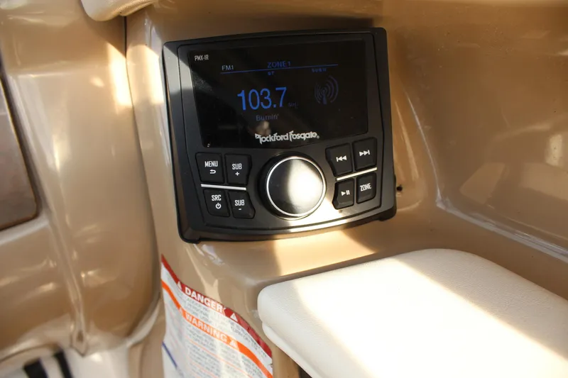 Slide: The Image of Rockford Fosgate stereo system in 2011 Chaparral 216 SSi boat, displaying FM radio. - 14