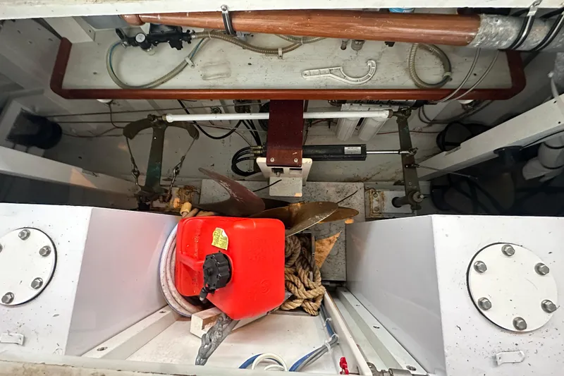 Slide: The Image of Engine compartment of 1973 Grand Banks 36 Classic with propeller and red fuel container. - 15