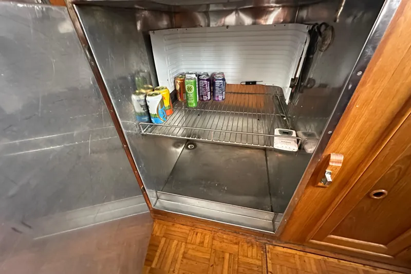 Slide: The Image of Open refrigerator on 1973 Grand Banks 36 Classic boat with drinks inside. - 34