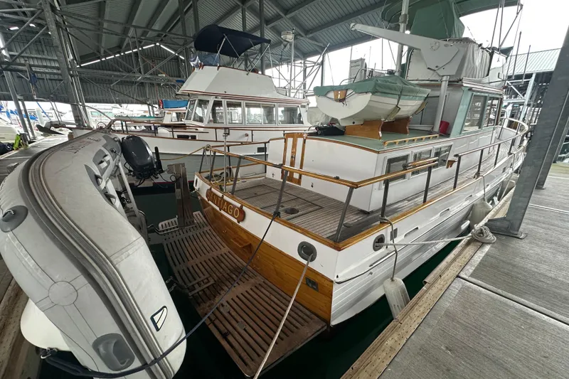 Slide: The Image of 1973 Grand Banks 36 Classic yacht docked in a covered marina. - 4