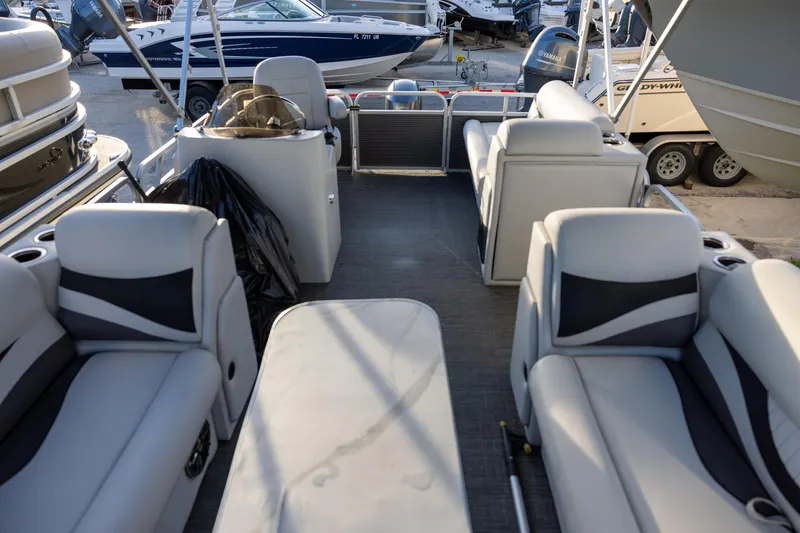 Slide: The Image of Interior of 2022 Qwest Lanai 818 pontoon boat with modern seating and helm. - 10