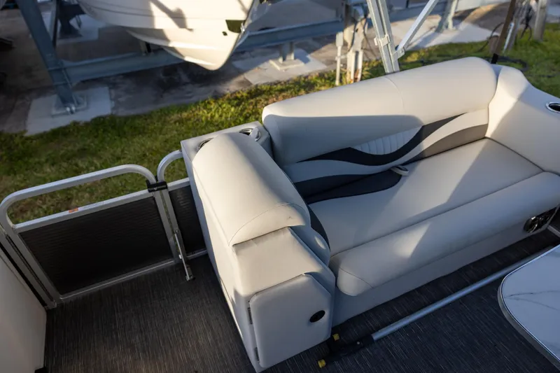 Slide: The Image of 2022 Qwest Lanai 818 boat interior with stylish seating and modern design. - 8