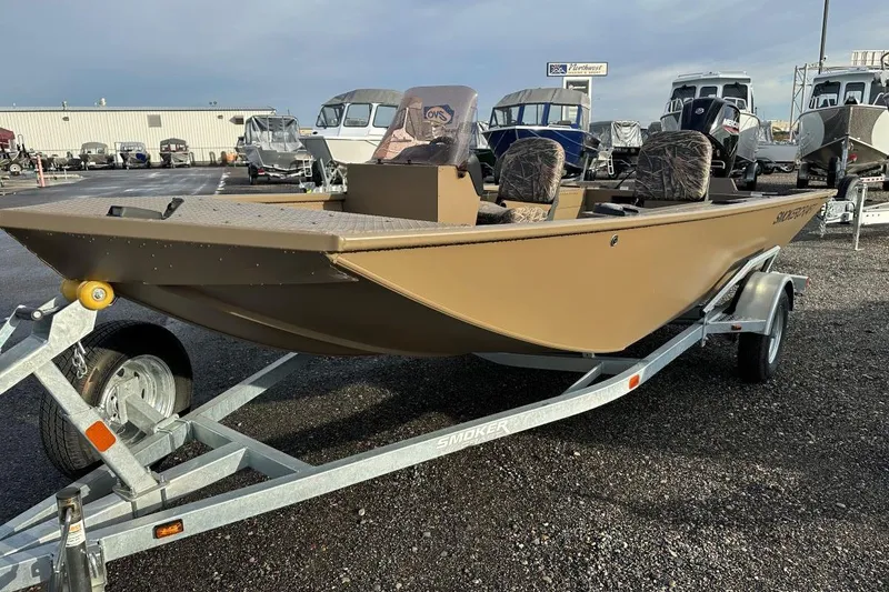 Slide: The Image of 2023 SMOKERCRAFT 1660 SPORTSMAN PRO SC boat on trailer at dealership. - 1