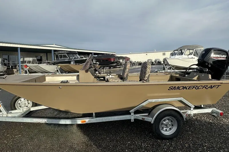 Slide: The Image of 2023 SMOKERCRAFT 1660 SPORTSMAN PRO SC boat on trailer, outdoor display. - 2