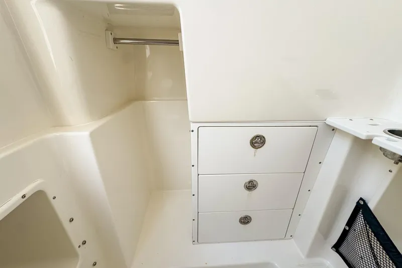 Slide: The Image of Interior storage area of 2007 Triton 351 CC boat with drawers and compartments. - 120