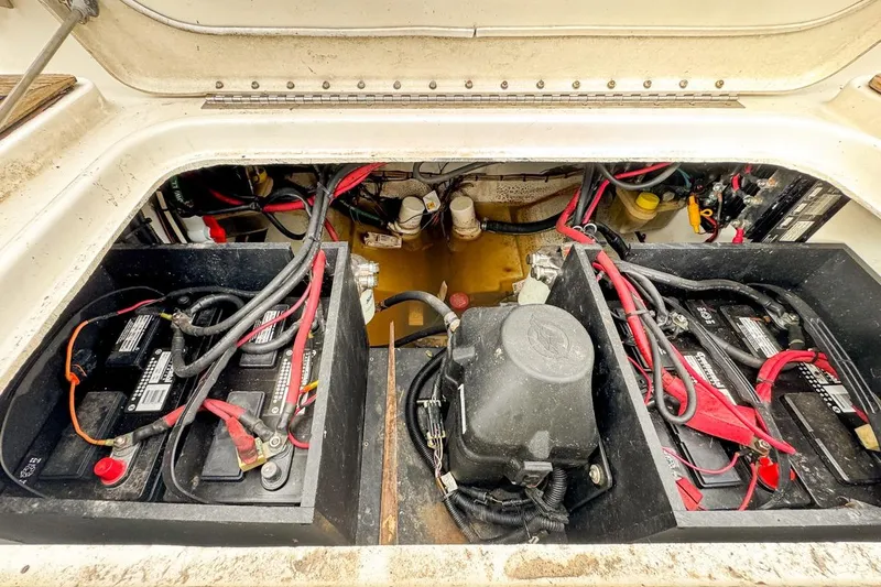 Slide: The Image of 2007 Triton 351 CC boat battery compartment with wiring and components. - 33