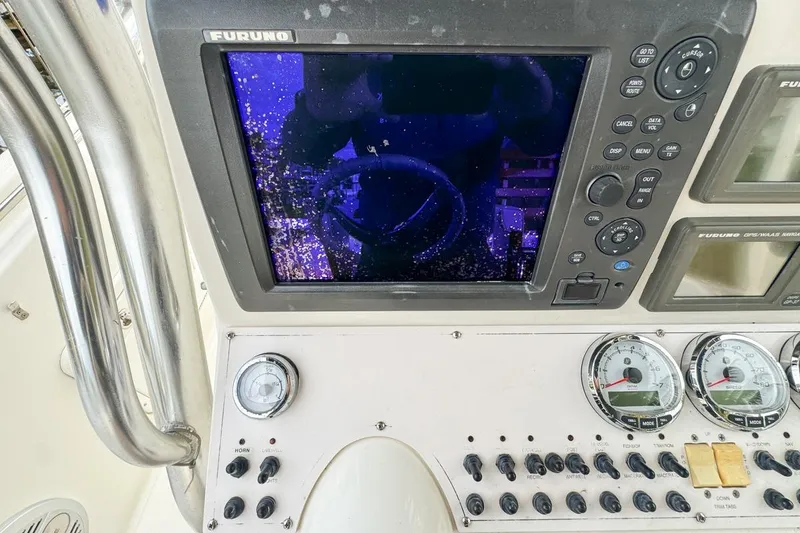Slide: The Image of Control panel of a 2007 Triton 351 CC boat with Furuno navigation system. - 62