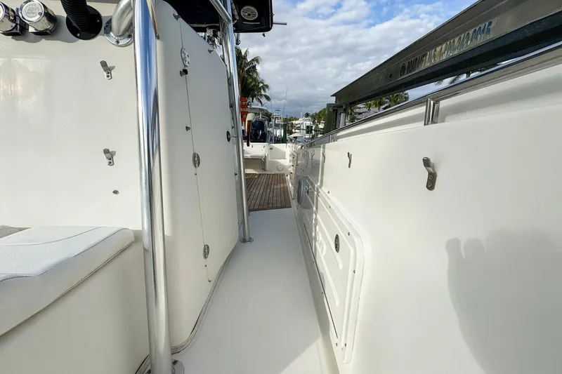 Slide: The Image of 2007 Triton 351 CC boat deck with stainless steel railings and seating. - 72
