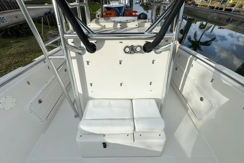 Slide: The Image of 2007 Triton 351 CC boat interior with seating and storage compartments. - 73