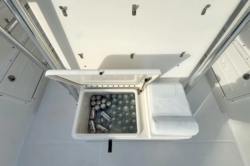 Slide: The Image of Open cooler with drinks on 2007 Triton 351 CC boat deck. - 80