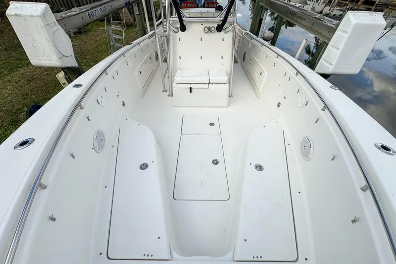 Slide: The Image of 2007 Triton 351 CC boat interior with spacious deck and seating. - 82