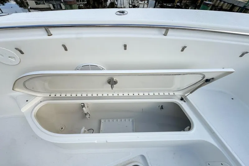 Slide: The Image of Open storage compartment on a 2007 Triton 351 CC boat deck. - 95