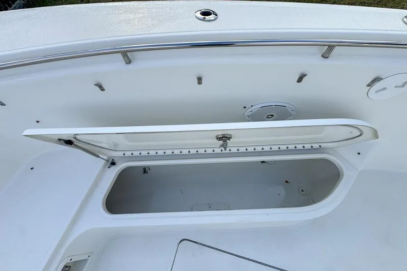 Slide: The Image of Open storage compartment on 2007 Triton 351 CC boat deck. - 96