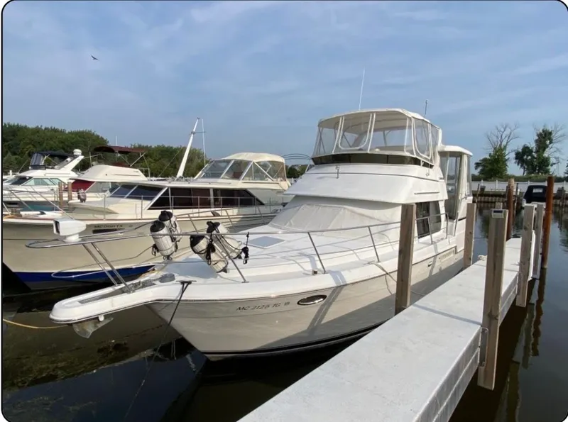 The Image of 2001 Carver 356 Aft Cabin Motor Yacht docked at marina. - 0
