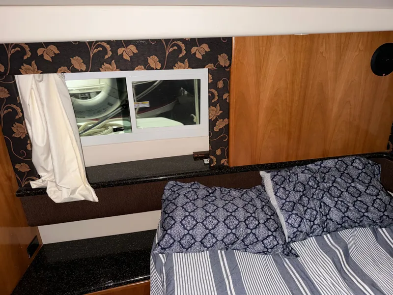 Slide: The Image of Interior of 2001 Carver 356 Aft Cabin Yacht with bed and window. - 22