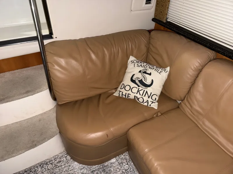 Slide: The Image of Interior of Carver 356 Yacht with leather sofa and pillow. - 36