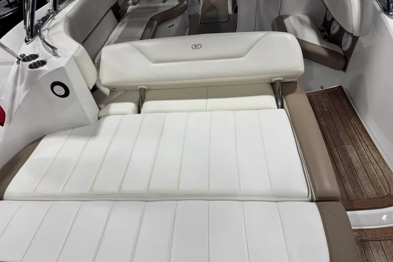 Slide: The Image of Luxurious 2011 Cobalt boat interior with white leather seating and wooden flooring. - 13