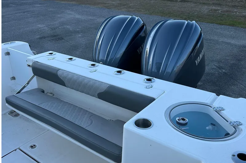 Slide: The Image of 2025 Sea Born SX281 Offshore boat with dual Yamaha engines and seating area. - 10