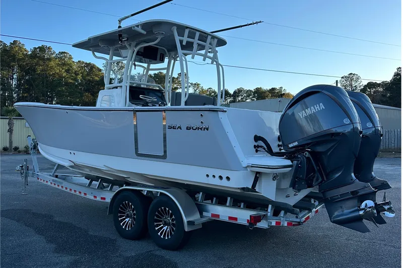 Slide: The Image of 2025 Sea Born SX281 Offshore boat on trailer with Yamaha engines. - 12