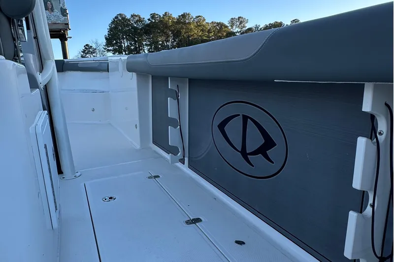 Slide: The Image of Interior view of 2025 Sea Born SX281 Offshore boat, featuring sleek design and logo. - 3