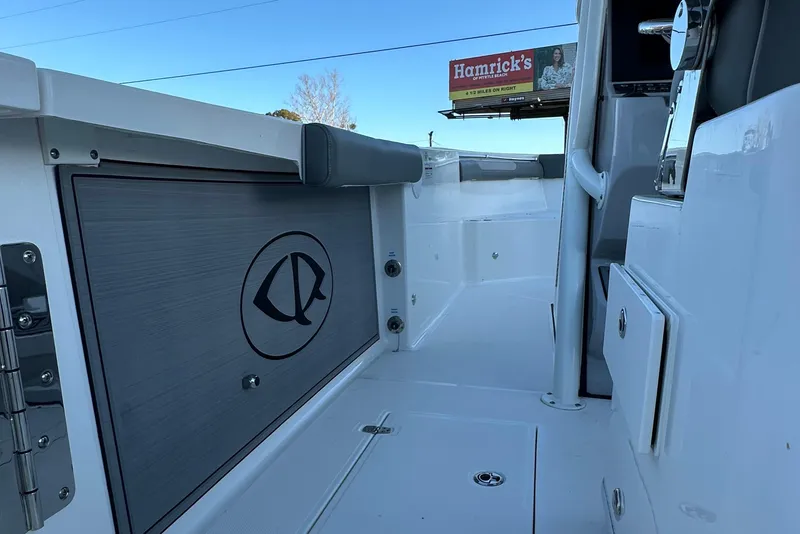 Slide: The Image of 2025 Sea Born SX281 Offshore boat interior with storage compartment and sleek design. - 4